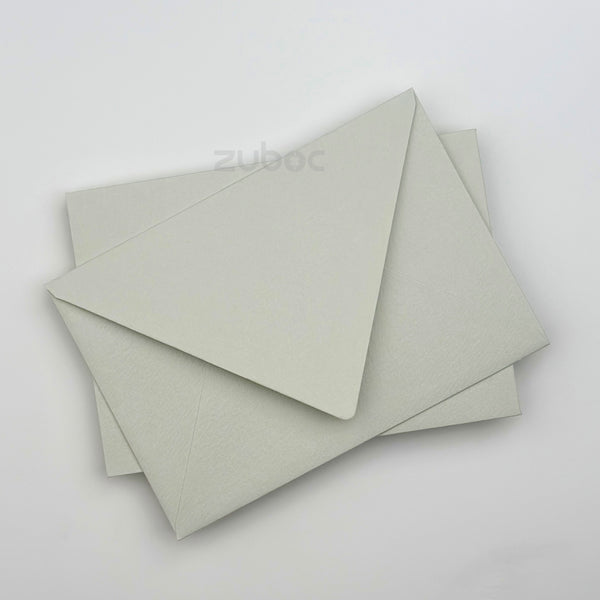 Light gray envelope C6 top-down view for wedding crafts