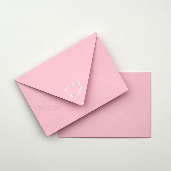 Soft pink envelope C6 top-down view for wedding crafts