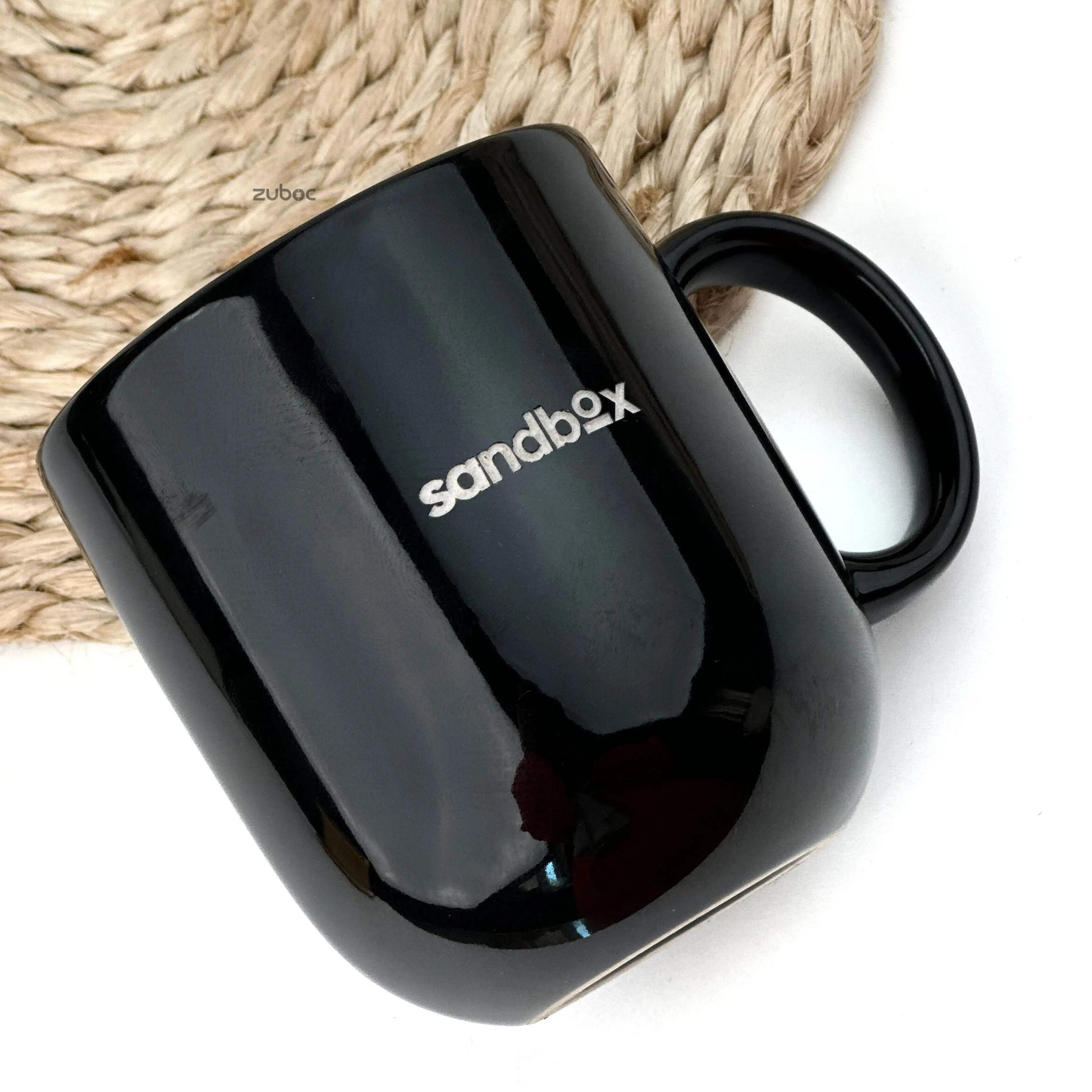 Two black mugs stacked on top of each other, one with 'His' and the other with 'Her', on a white background.