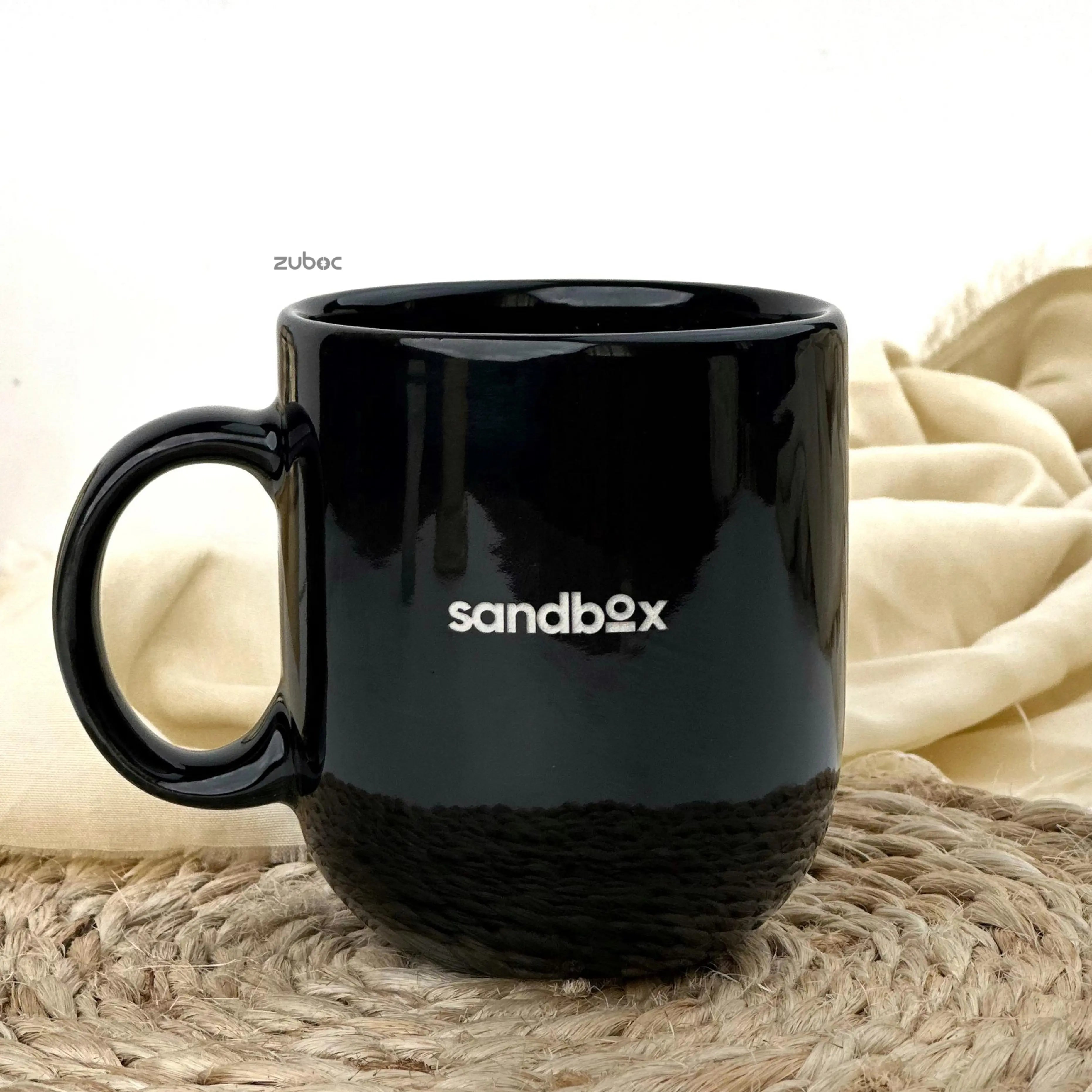 Two black mugs stacked on top of each other, one with 'His' and the other with 'Her', on a white background.