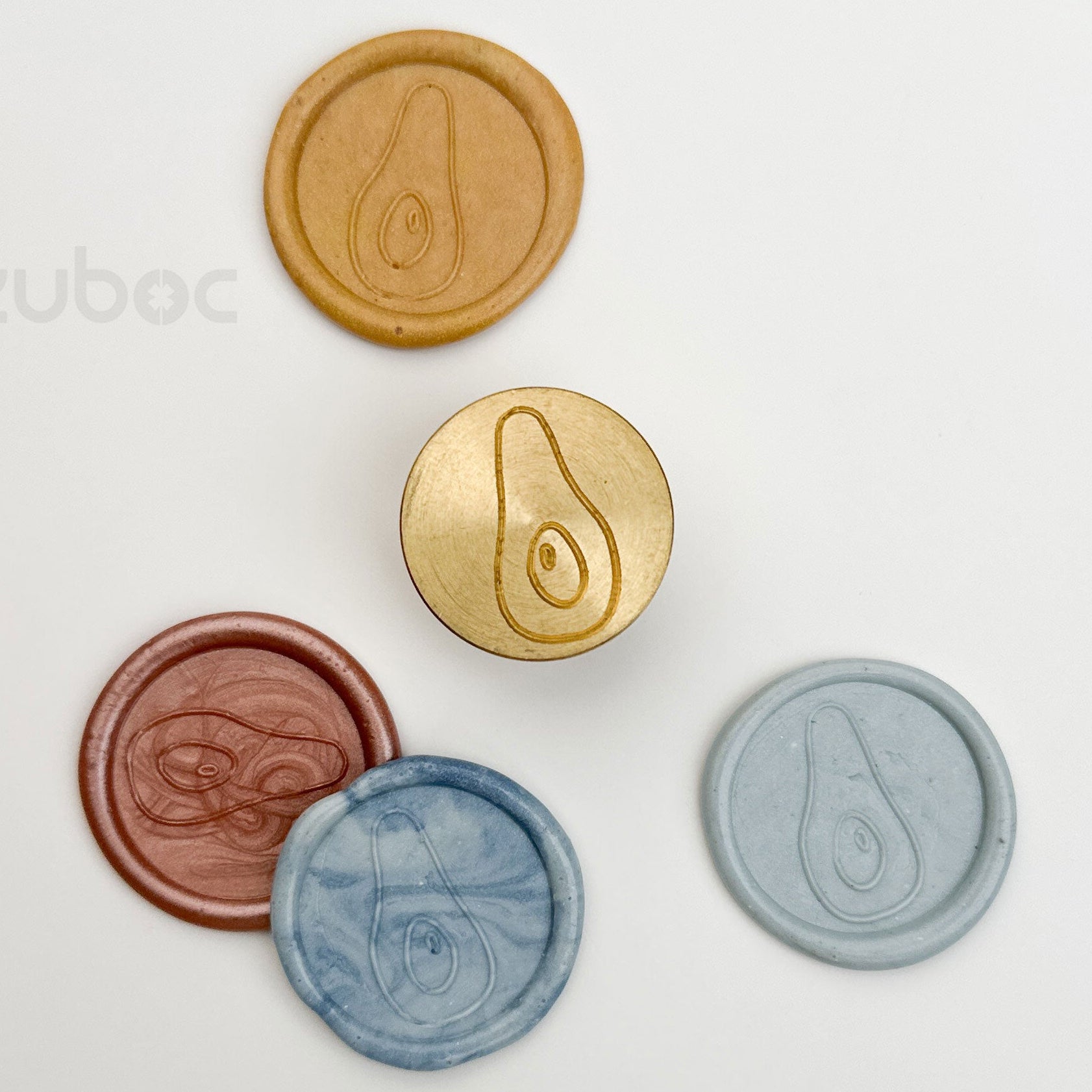 Gold wax stamp top-down view for handmade cards