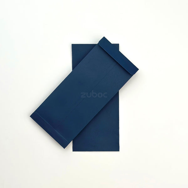 Deep navy blue catalog envelope top-down view for art projects