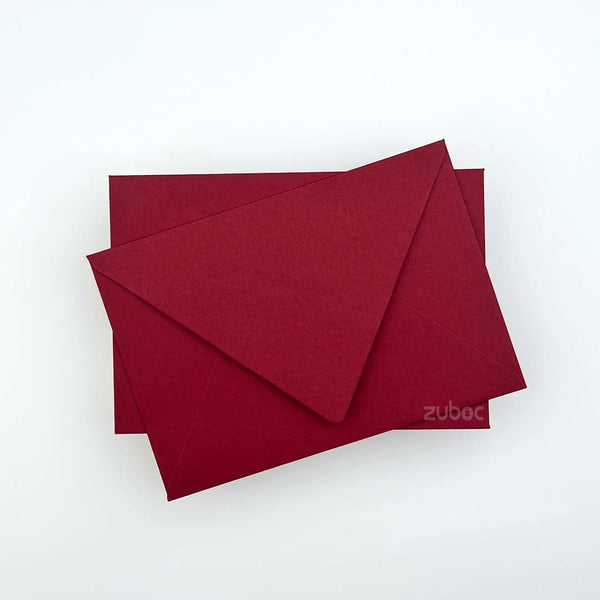 Deep red counter flap envelope C6 top-down view for party crafts
