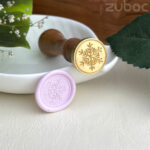 Snow wax seal stamp with a smooth wooden handle