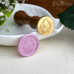 Custom wax seal stamp featuring a cupcake design