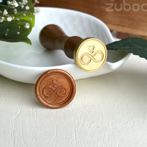 Custom wax seal stamp featuring an engagement design