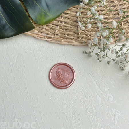 Wax seal with a rose gold branch design on ideal envelopes-1