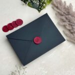 std black envelope with wine red rose wax seal