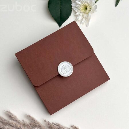 Chocolate brown square envelope with cream white duo ring wax seal