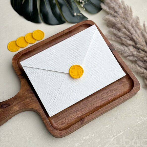 Snow white envelope and yellow gooseberry wax seal