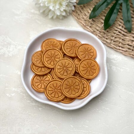 Orange Slice wax seal in Light Gold creates an ideal look for envelopes