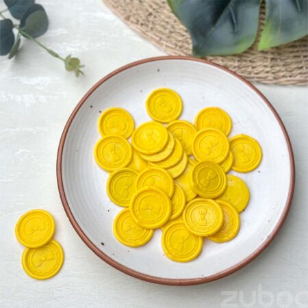 Wax seal with a yellow bow design, perfect for gifts and crafts