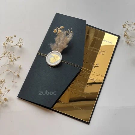 Wedding invitation with golden acrylic insert, wax seal, and dry flower for elegent look
